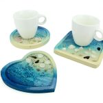 Set di 4 sottobicchieri rotondi in legno, diametro 11 cm.